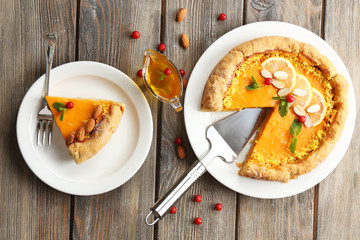 Homemade pumpkin pie on table