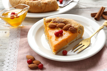 Homemade pumpkin pie on table
