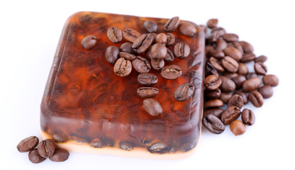 Organic soap with coffee beans, isolated on white