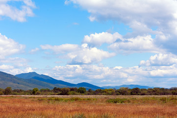 Fototapeta na wymiar Landscape with mountain views, blue sky and beautiful clouds.