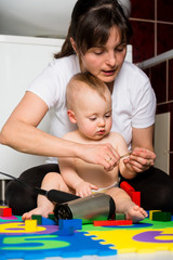 Mother and baby - cutting nails