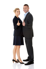 Business couple showing thumbs up