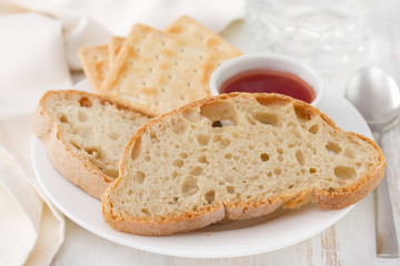 bread, toasts and jam on plate