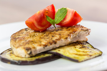Grilled Eggplant Slice With Pork Chop And Sliced Tomatoes
