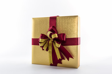 Gold and brown gift box with ribbon bow.