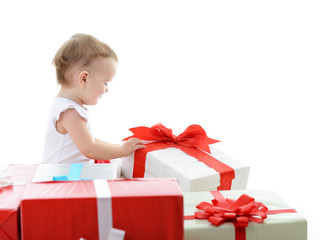 Holidays, baby girl opening box with presents, christmas, birthd