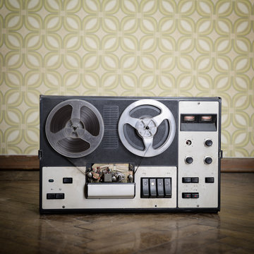 Old portable reel to reel tube tape-recorder, with copyspace. To