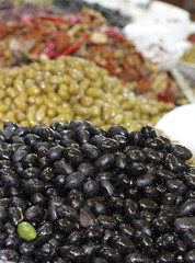 green olives of various kinds for sale at the market of southern