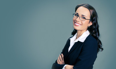 Smiling businesswoman, over gray
