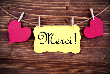Merci on a Tag Framed By Hearts