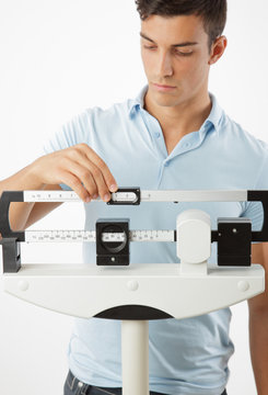 Man Adjusting Scale