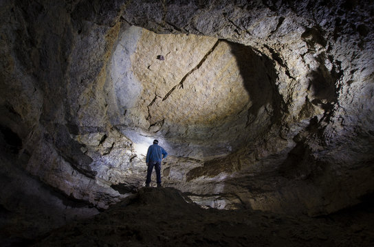 man in a huge cave