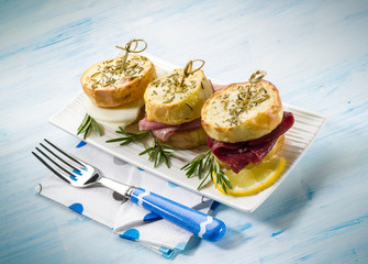 mixed potatoes sandwich with bresaola parma ham and cheese