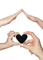 Fototapeta premium Women's and children's hand keep a heart