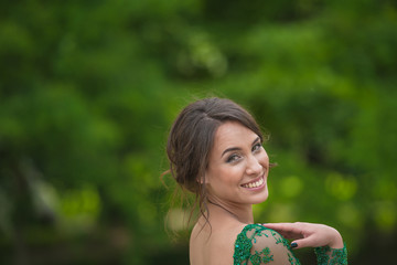 Close portrait of young adult woman in the park, official dress