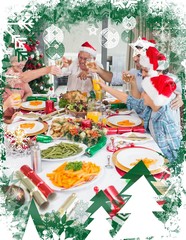 Naklejka premium Family in santas hats toasting wine glasses at dining table
