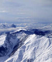 Winter mountains in mist at windy winter day