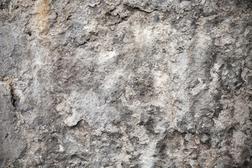 Obraz na płótnie Canvas Dark gray old concrete wall with stucco. Background texture