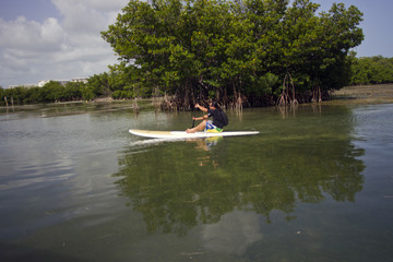 Rowing on a surf board