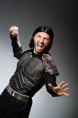 Angry warrior against dark background