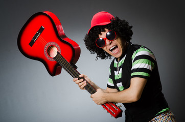 Obraz premium man with funny haircut and guitar
