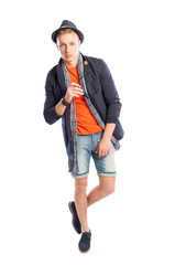 Short jeans and elegant suit jacket with scarf and hat.