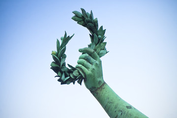 Laurel Wreath hand held by a bronze statue