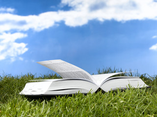 Open book with sky background