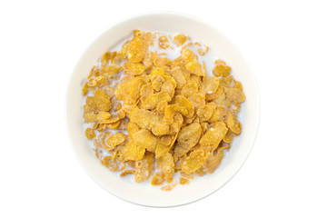 Closeup of corn flakes and milk in a bowl viewed from above