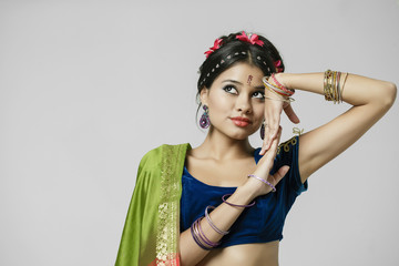 Young pretty woman in indian green dress