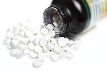 White vitamin pills