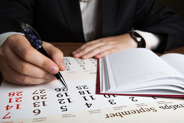 man calculates future plans