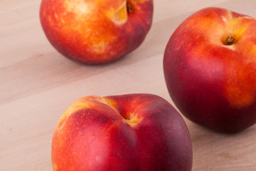 Three tasty fresh ripe juicy nectarines