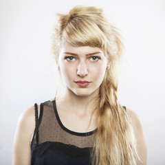 portrait of a young beautiful blonde woman on white background