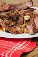 Plate of Grilled Steak and Garlic with Red Napkin