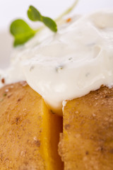 Baked jacket potato with sour cream sauce