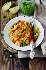 Paella with mussels and green peas