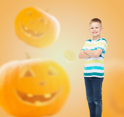 smiling boy over pumpkins background