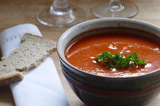 Detail of a red vegetable soup in a pottery bowl