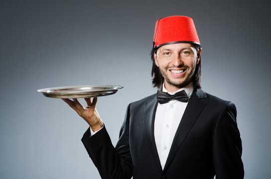 Waiter wearing traditional turkish hat
