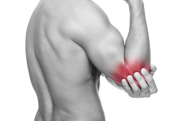 Young man holding his elbow in pain, isolated on white backgroun
