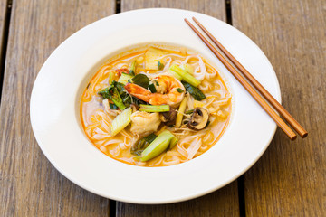 Bowl of traditional Thai tom yam soup