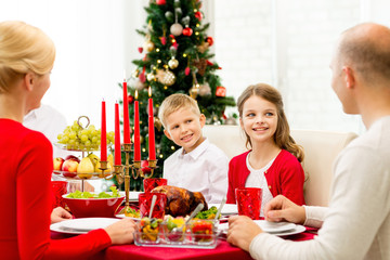 smiling family having holiday dinner at home