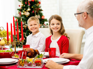 smiling family having holiday dinner at home