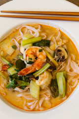 Bowl of traditional Thai tom yam soup