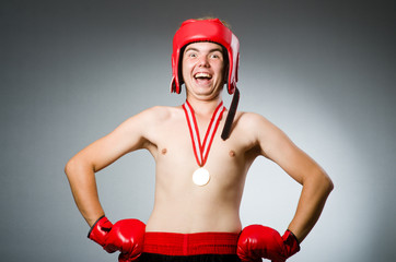 Funny boxer with winning gold medal