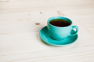 Cup of tea on wood background