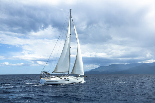 Sailing in cloudy weather. Yachting. Luxury yachts.