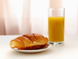 Croissants, Coffee, Orange Juice on table