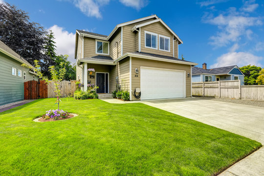 Two Story House Exterior With Front Yard Landscape